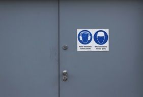 gray door with icons