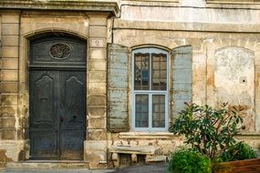 facade of an old house with windows and a door