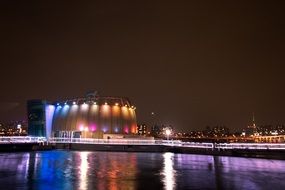 night illumination of a cafe by the river