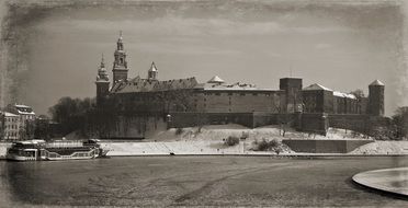 black and white photo of wawel castle in krakow in winter