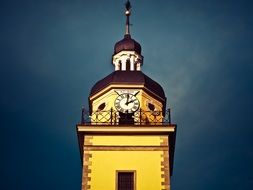 clock tower on yellow church