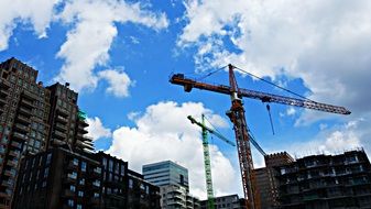 high-rise crane near the skyscraper