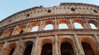 view from below of colosseum in Rome