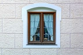 strikingly beautiful Wooden Windows on a building wall