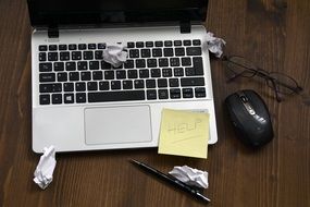 Laptop, Mouse and List Notebook