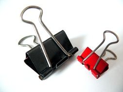 two multi-colored paper clamps