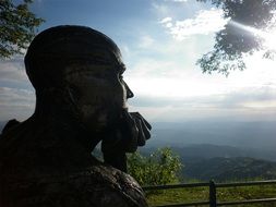 sculpture of man looking at gorgeous landscape in Colombia, Manizales