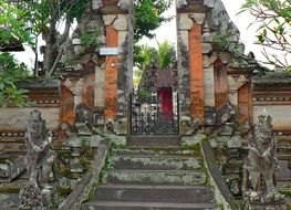 ornate gate in fence, indonesia, Bali