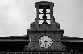 bell tower with a clock on a city building