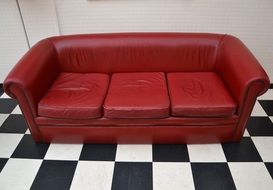 red sofa and draughts floor