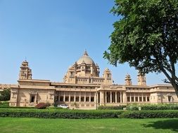 green field near a palace in india