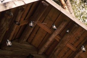 lights garland under a wooden roof