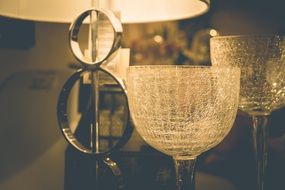 elegant floor lamp and glasses on the table