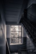 Dark staircase of a ramshackle building