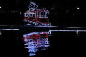 glowing tram on a pond in Moscow