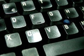 closeup picture of black computer keyboard with letters