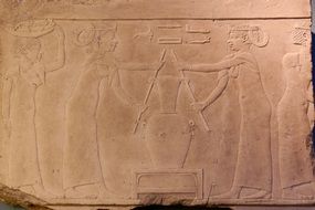 egyptian tombstone with drawings
