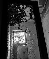 monochrome picture of broken window glass