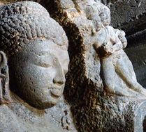 carved Buddha sculpture in ajanta caves