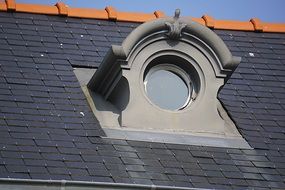 Round Window on tile roof