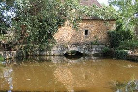 stone house near water