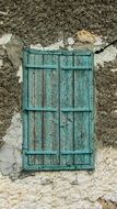 turquoise weathered window in Xylotymbou