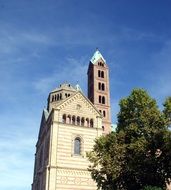 Spire on the church under the blue sky