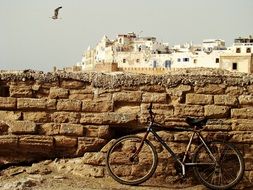 bike is parked in a harbor in Essaouira, Morocco