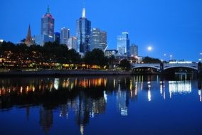 Melbourne architecture reflected in water at dusk