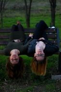 two girls on the park bench