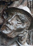 Face of soldier, bronze Relief