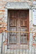 shabby entrance doors of an old house