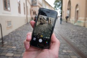 photo of the old town on the phone screen