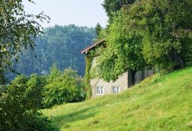 old house amid a romantic picturesque landscape