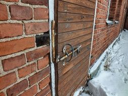 Old Door with Lock in brick wall