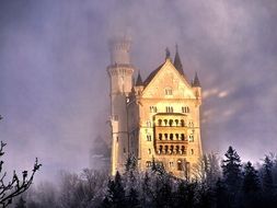 castle through misty clouds in the haze in bavaria