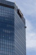 Cleaner on the skyscrapers window