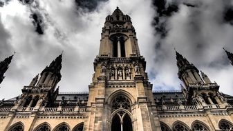 city hall building under white clouds