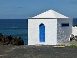 white house on the sea
