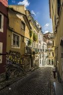 narrow road among houses in portugal