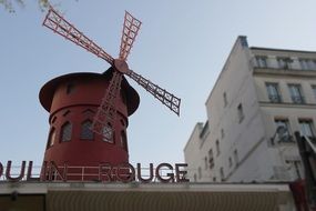 windmill near the building in paris