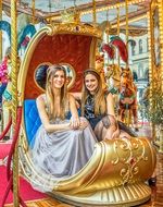 Girl on a golden carousel in Florence