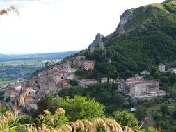picturesque landscape with old city on green mountain side, italy, Pietravairano