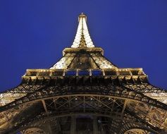 backlit eiffel tower under the evening sky