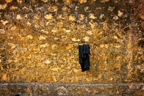 black worn clothes near the bright and colorful wall