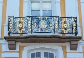 Baroque forged fence with golden elements on Balcony