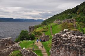 ruins of the vibrant castle of urquhart near a lake in scotland