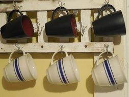 coffee cups hanging on the wall