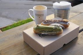 fresh delicious eclairs and coffee