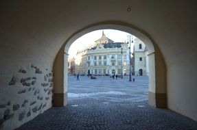 view from tunnel of the city through the arch